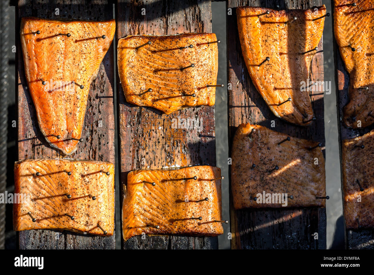 Open fire cooking of salmon, Espoo, Finland Stock Photo