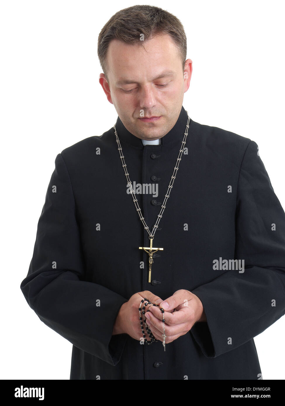 Catholic priest saying his rosary beads Stock Photo