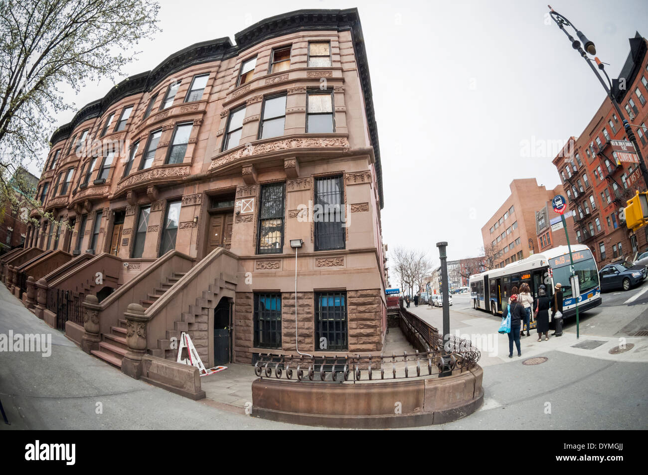 Attached row of brownstone buildings on Convent Avenue in the Harlem