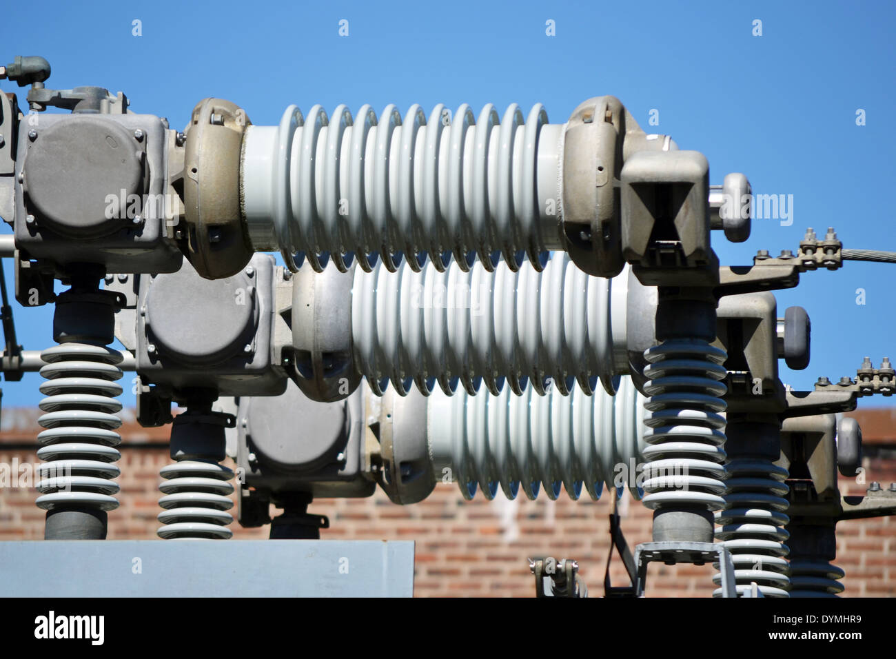 A view of a high voltage substation with switches and insulators Stock Photo