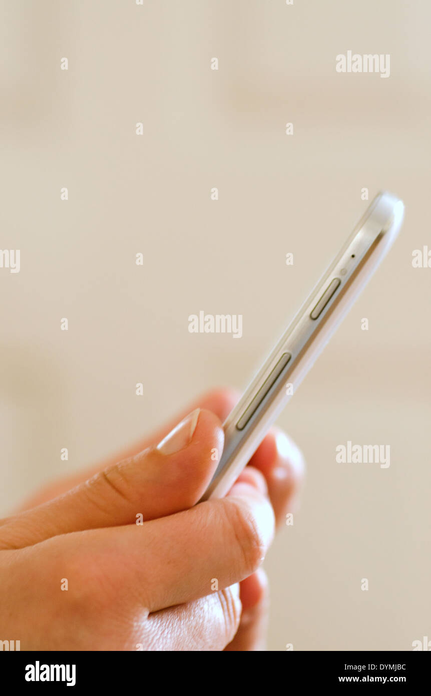 Woman's hands holding a mobile phone Stock Photo