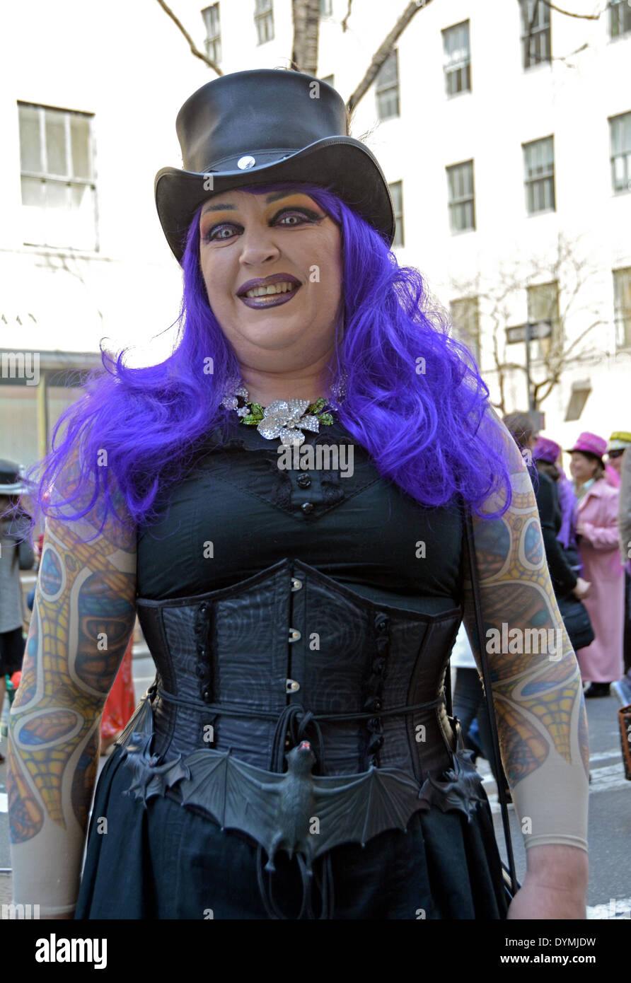 A woman with purple hair and a top hat & bats in her belt at the Easter Parade in Midtown Manhattan, New York City Stock Photo