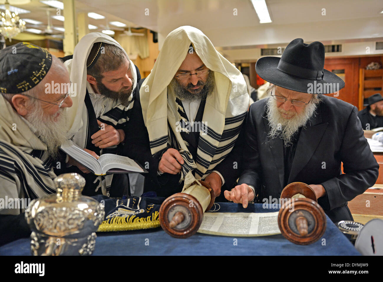 Reading from a Torah scroll at Passover morning service at Lubavitch headquarters in Crown Heights, Brooklyn, New York. Stock Photo