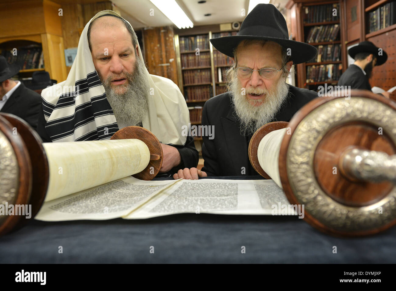 Reading from a Torah scroll at Passover morning service at Lubavitch headquarters in Crown Heights, Brooklyn, New York. Stock Photo