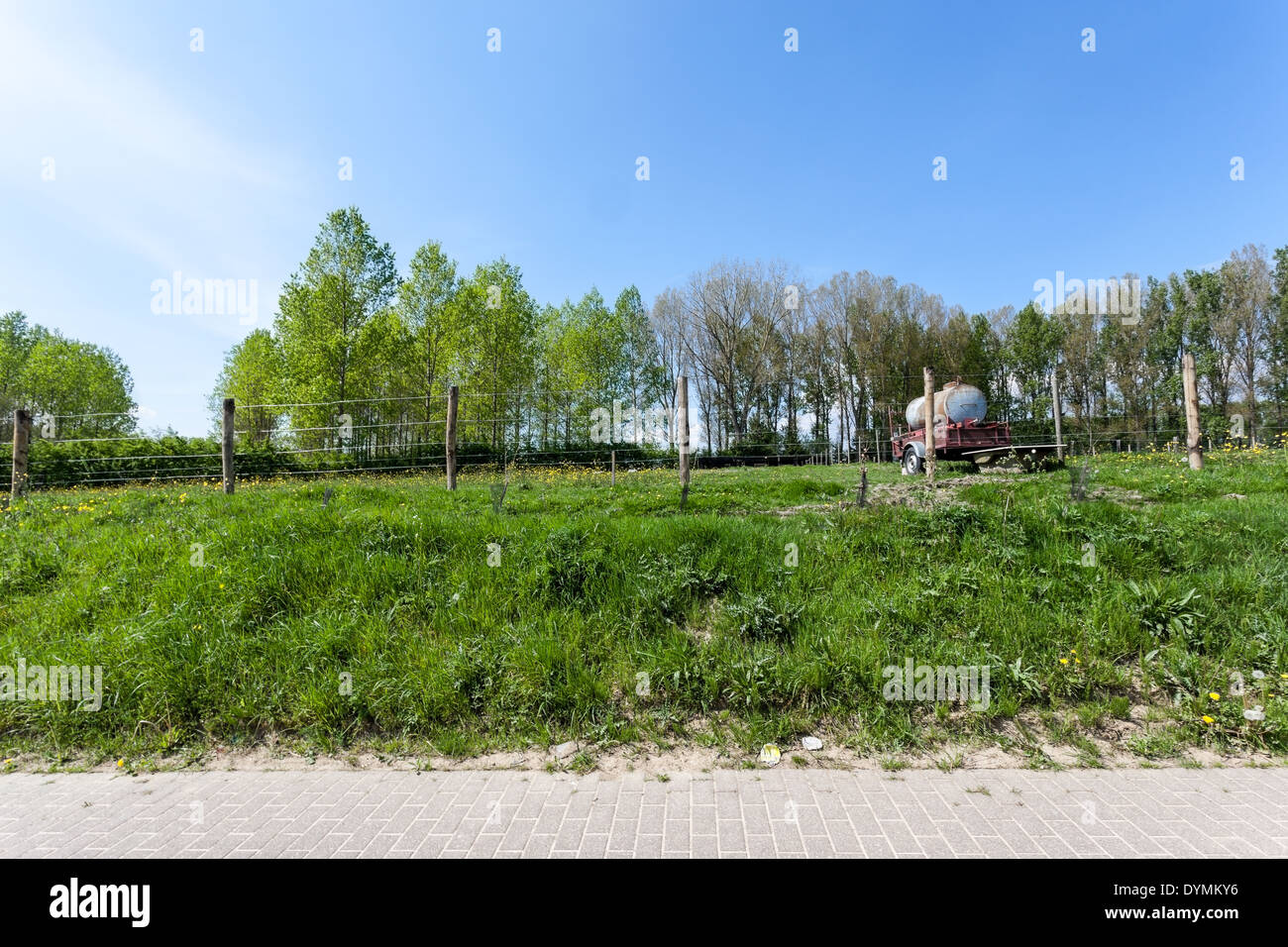 longest track, there are many meadows with fence around it Stock Photo