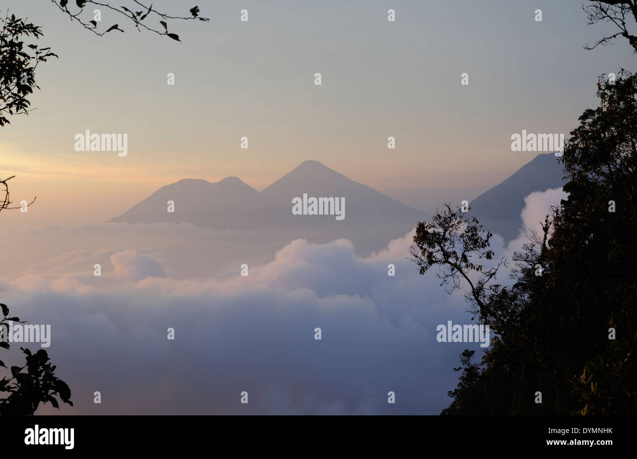 Volcan Toliman, 3153m, and, behind it,  Volcan Atltlan, 3525m across lake Atitlan, hidden by cloud, Stock Photo