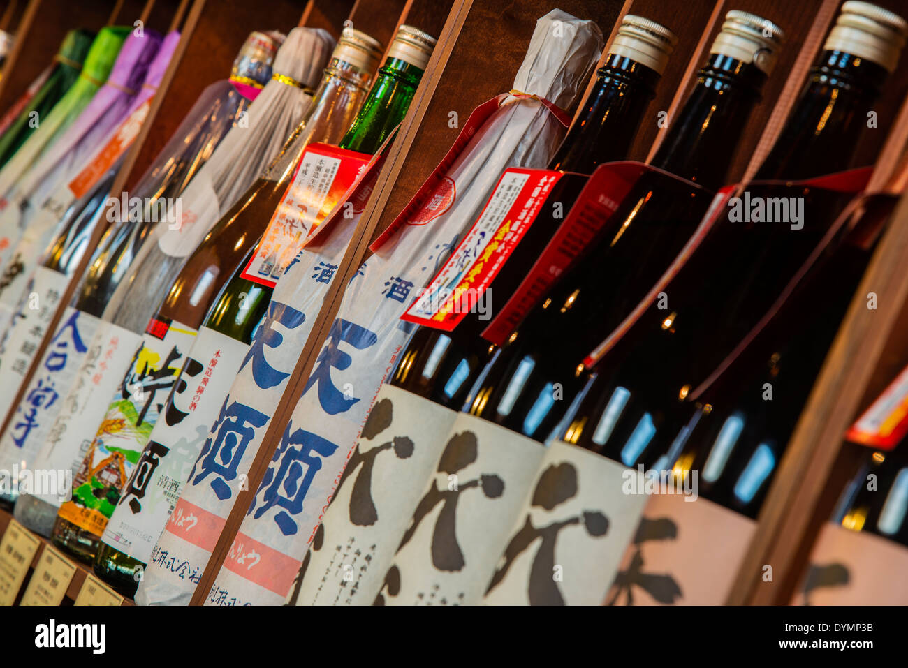Sake bottles in a sake brewery, Takayama, Gifu Prefecture, Japan Stock Photo