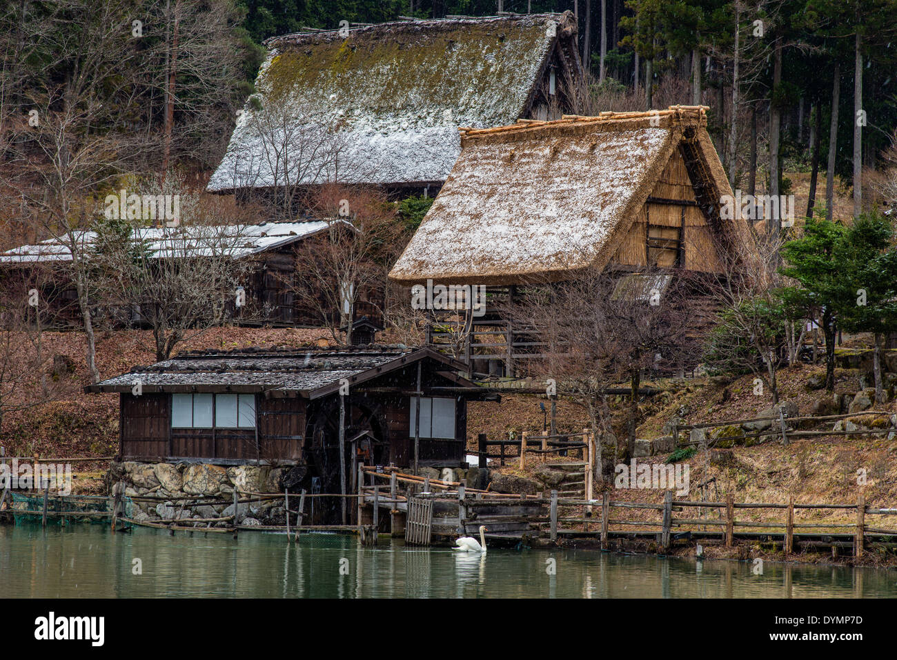 Old farmhouses under a snowfall at Hida Minzoku Mura Folk Village, Takayama, Gifu Prefecture, Japan Stock Photo