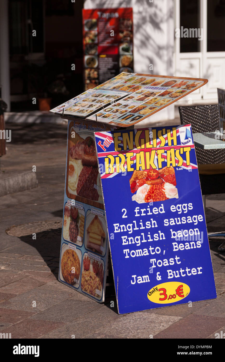 Restaurant board advertising English breakfasts to ex pats and British holidaymakers in Los Cristianos, Tenerife, Stock Photo