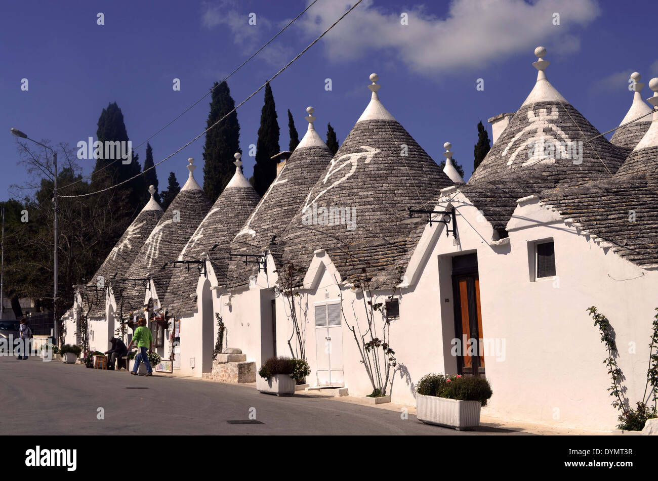 Alberobello,'Trulli' style houses with decorative style roof's each with its cross on top.They have existed since 15thC AD Stock Photo