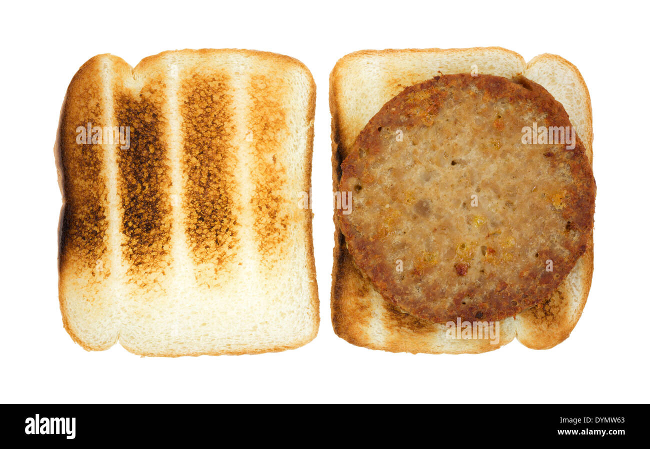 A vegetable burger patty on toasted bread. Stock Photo