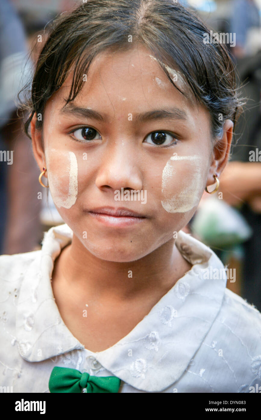 Girl with painted face in the street of Yangon Burma Stock Photo Alamy