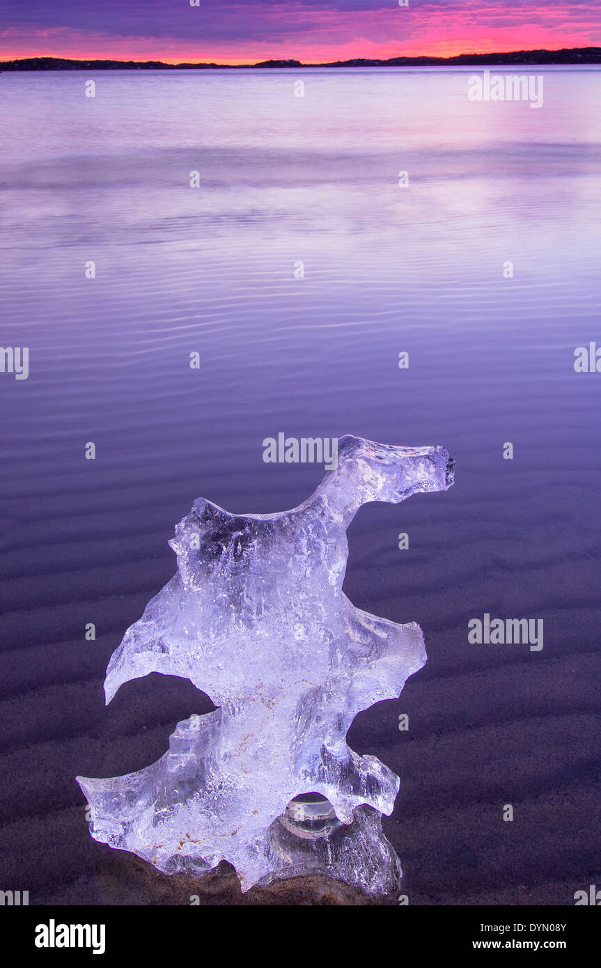 Block of ice lying on the surface of water Stock Photo - Alamy