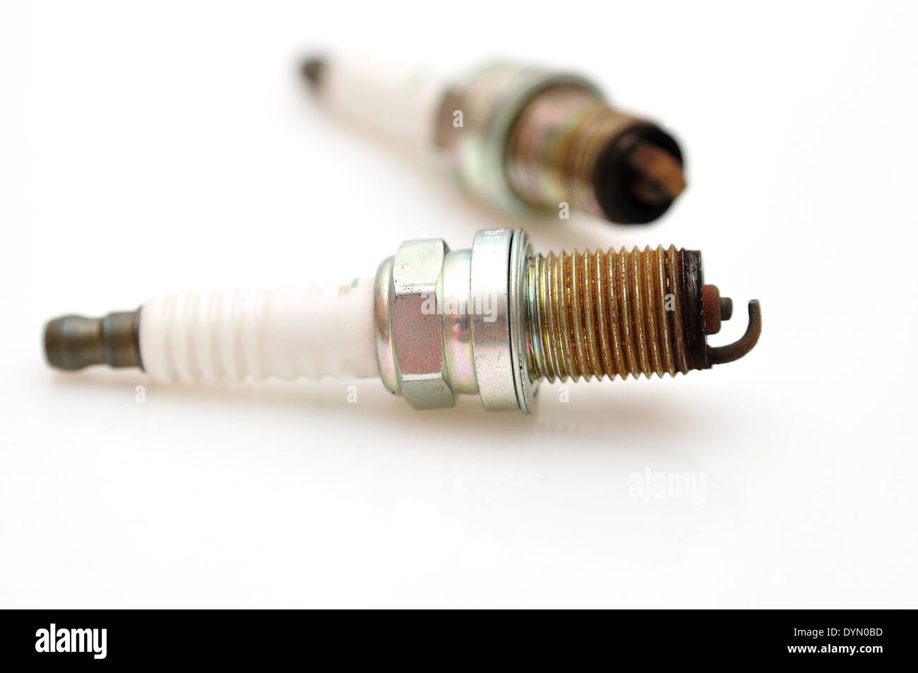 Single electrode used car sparks isolated on white background Stock