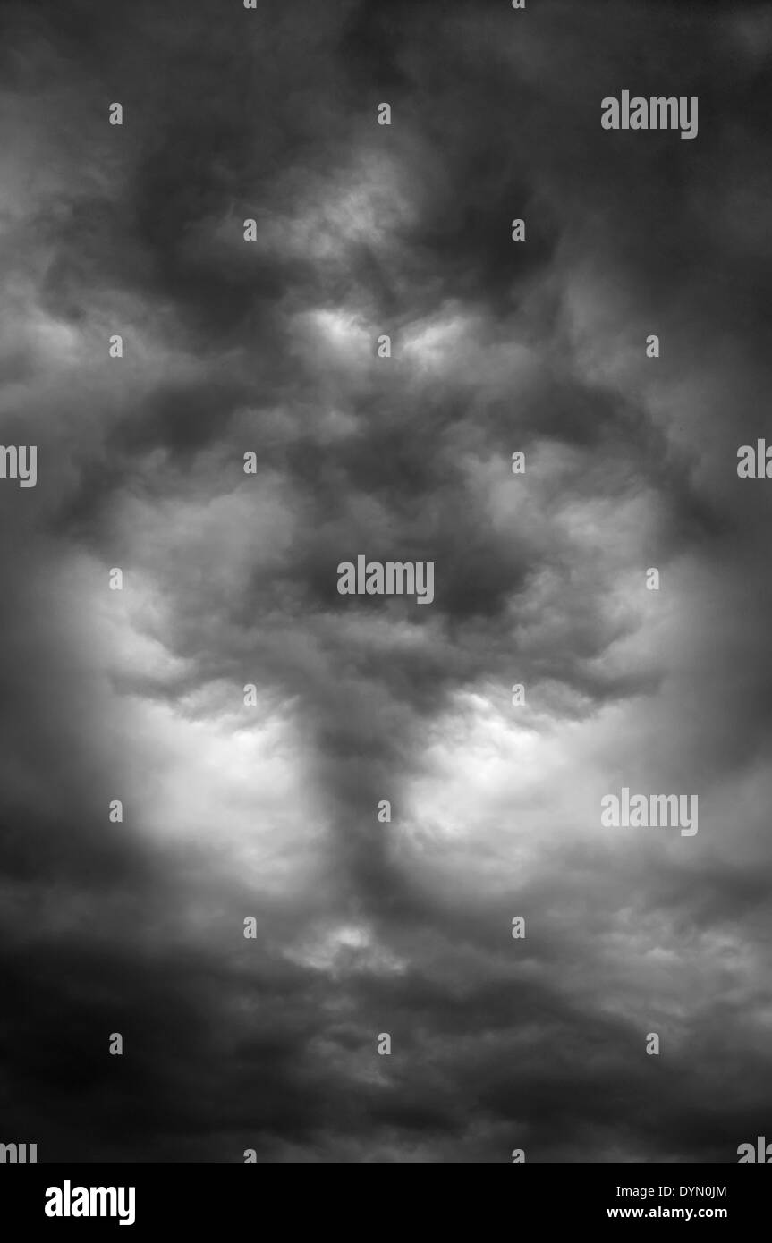 Dark clouds create a horrible daemon in the sky Stock Photo