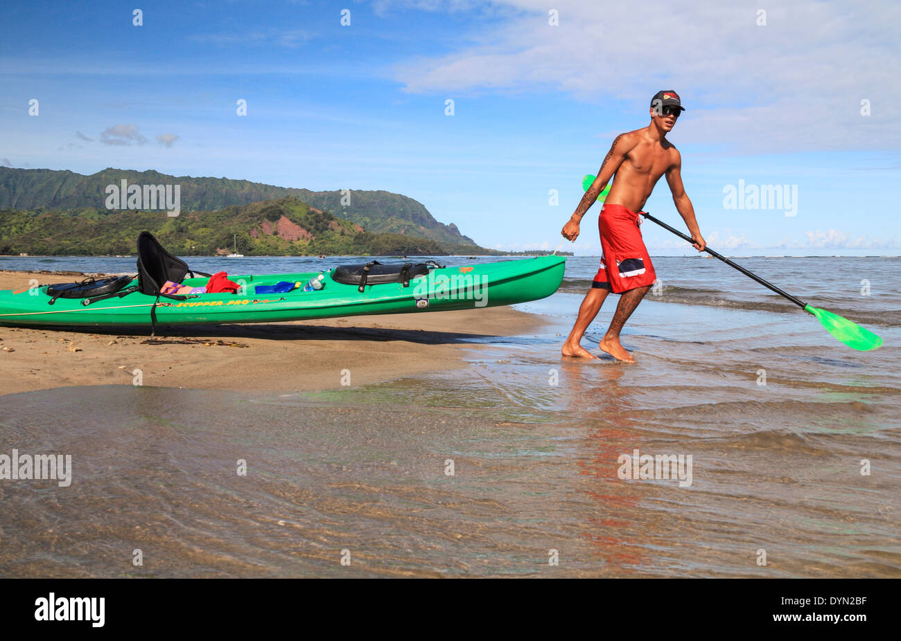 Guide drags kayak into the Hanalei River by Hanalei Bay Stock Photo Alamy