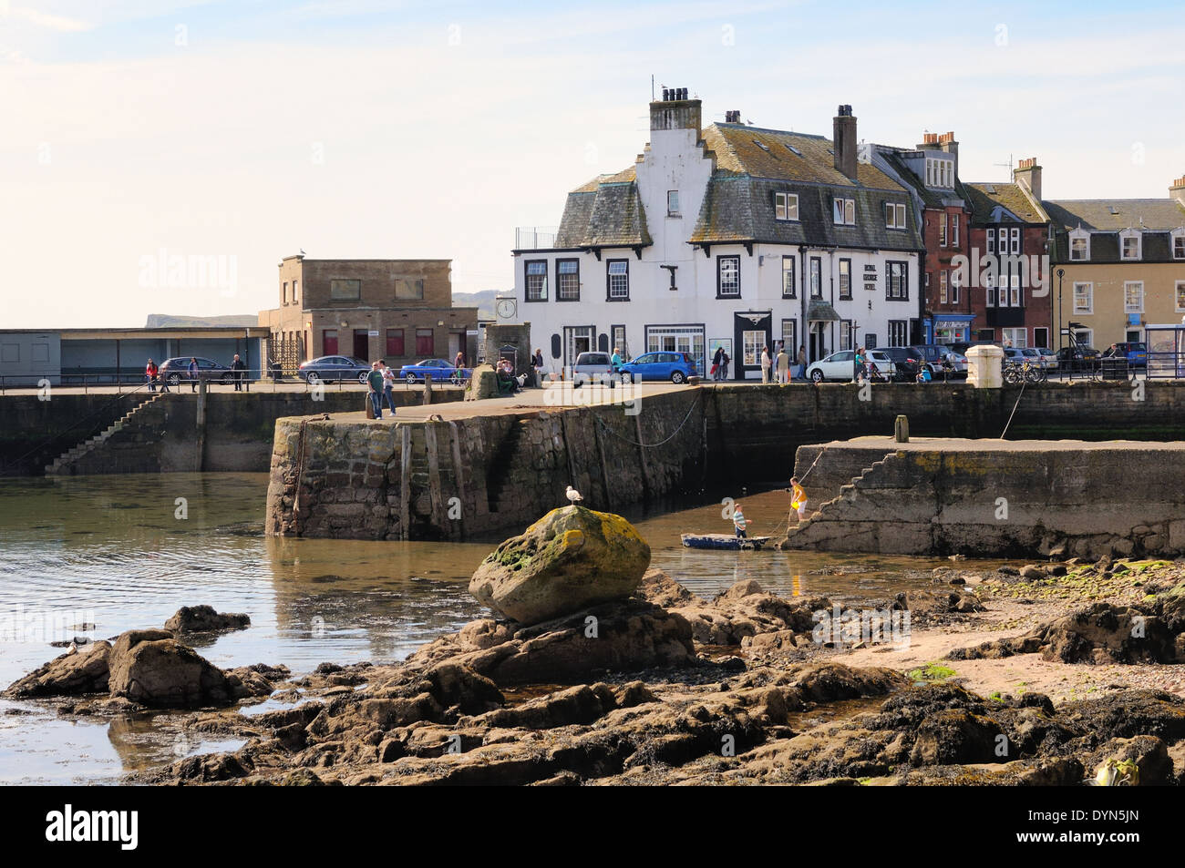 Pier wall and King George Hotel in Millport, Isle of Cumbrae, Scotland, UK Stock Photo