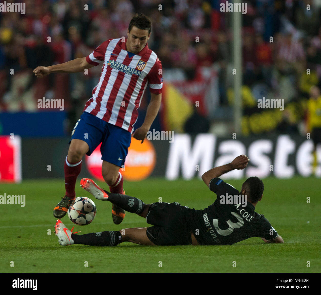 Madrid, Spain. 22nd Apr, 2014. Chelsea's Ashley Cole(down) vies for the ball during the Champions League semi-final first leg soccer match against Atletico Madrid in Madrid, Spain, April 22, 2014. The match ended with a 0-0 draw. Credit:  Xie Haining/Xinhua/Alamy Live News Stock Photo