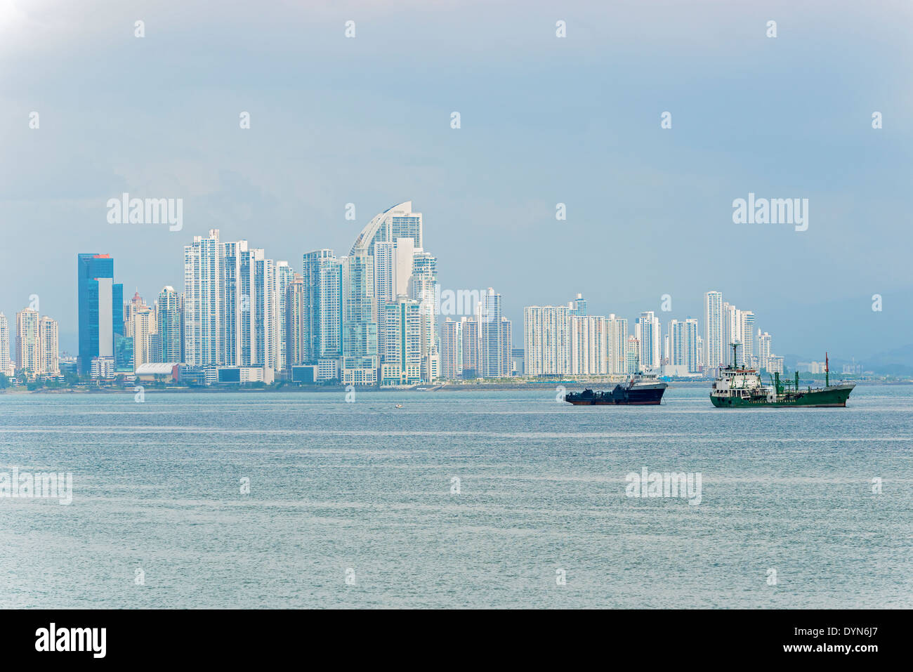 Shipping boats in Panama Bay on the background Panama City skyscrapers skyline. Sunny day in January 2, 2014. Stock Photo