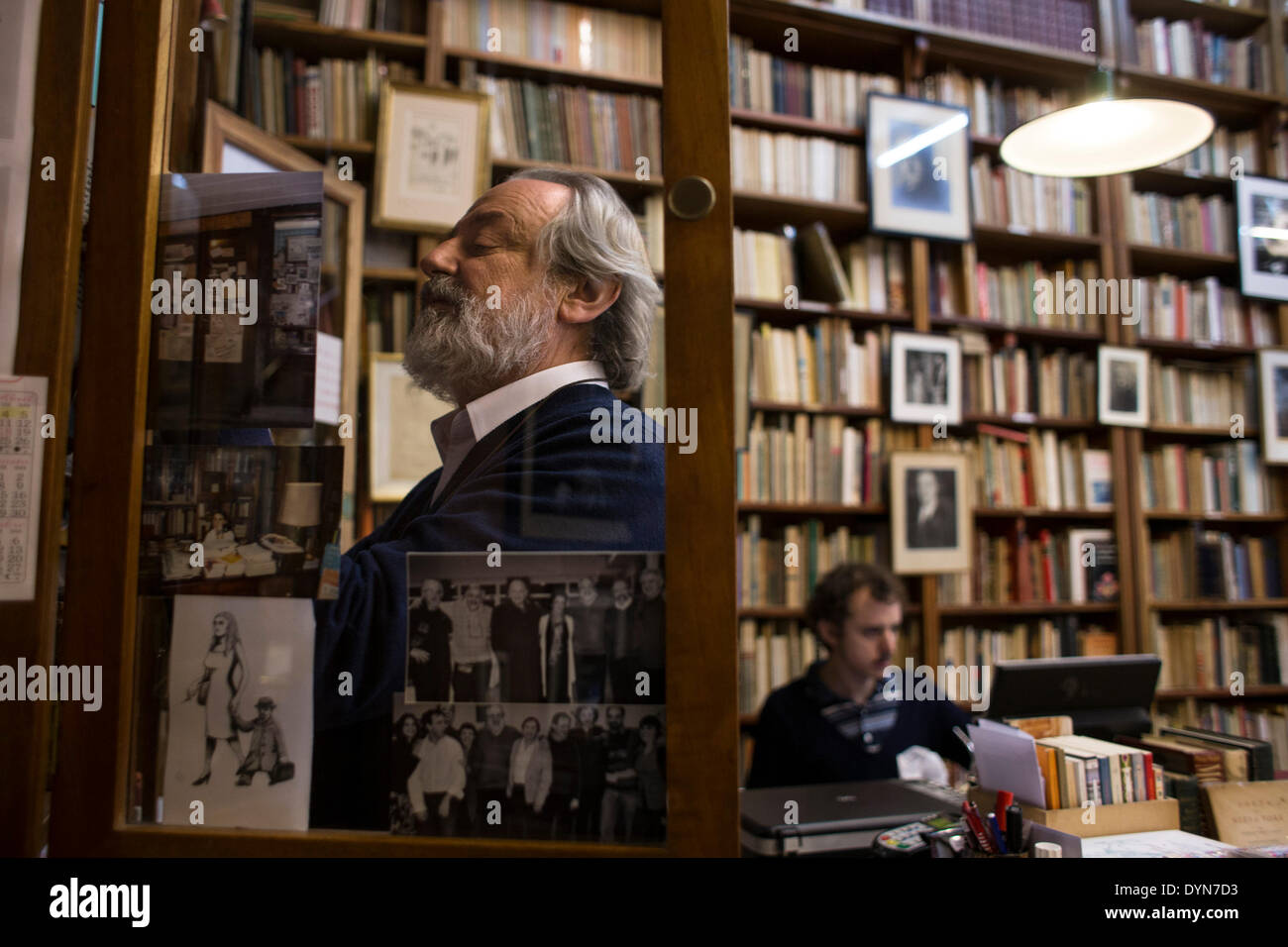 Buenos Aires, Argentina. 22nd Apr, 2014. Alberto Casares, a book seller, watches a shelf in his library specialized in old books, in the city of Buenos Aires, capital of Argentina, on April 22, 2014. The World Book Day is commemorated on Wednesday, aiming to promote reading, and boost the editorial industry and the protection of the intellectual property by copyrights. © Martin Zabala/Xinhua/Alamy Live News Stock Photo
