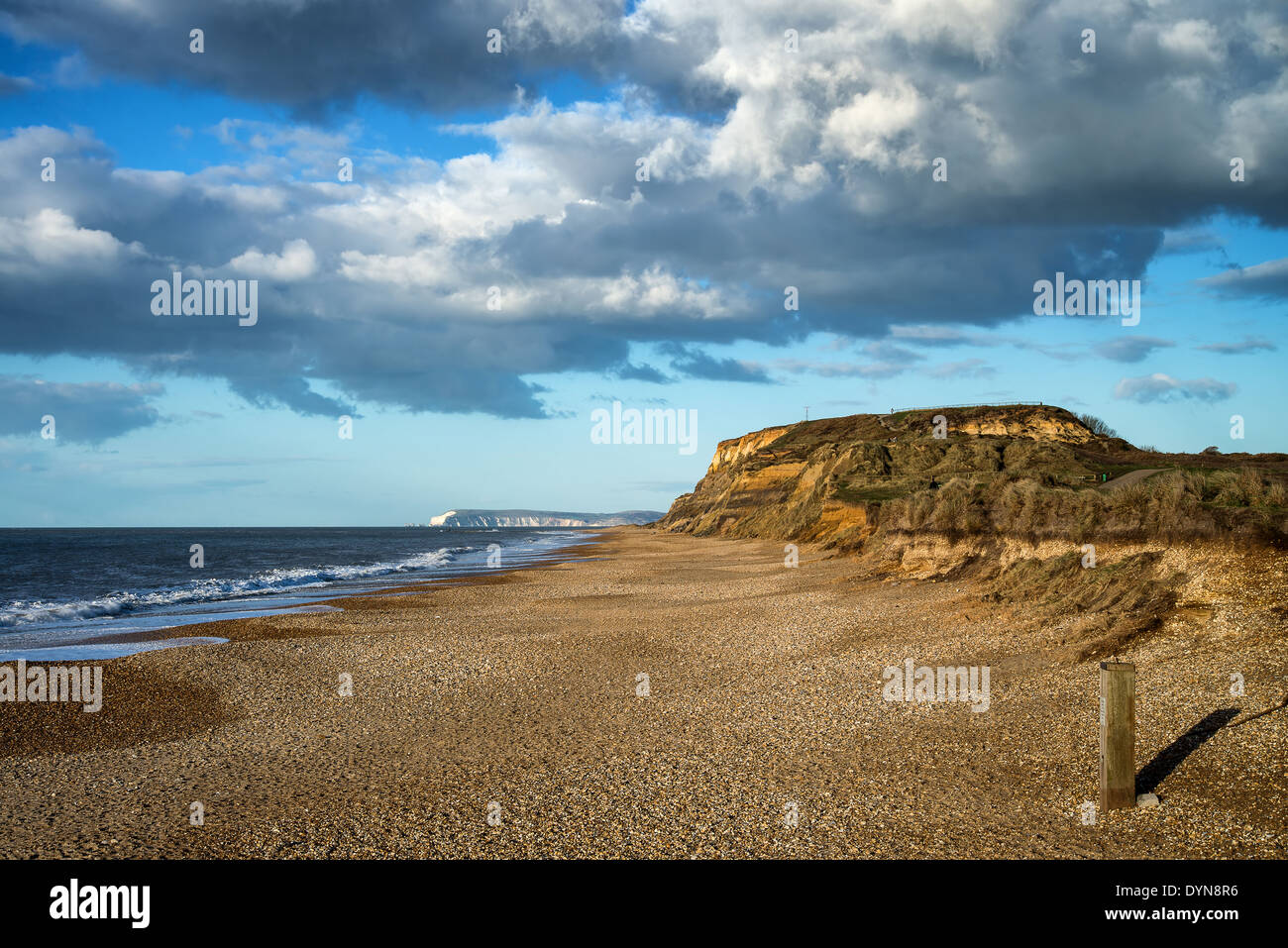 Landscape vibrant sunset over beach and cliffs Stock Photo