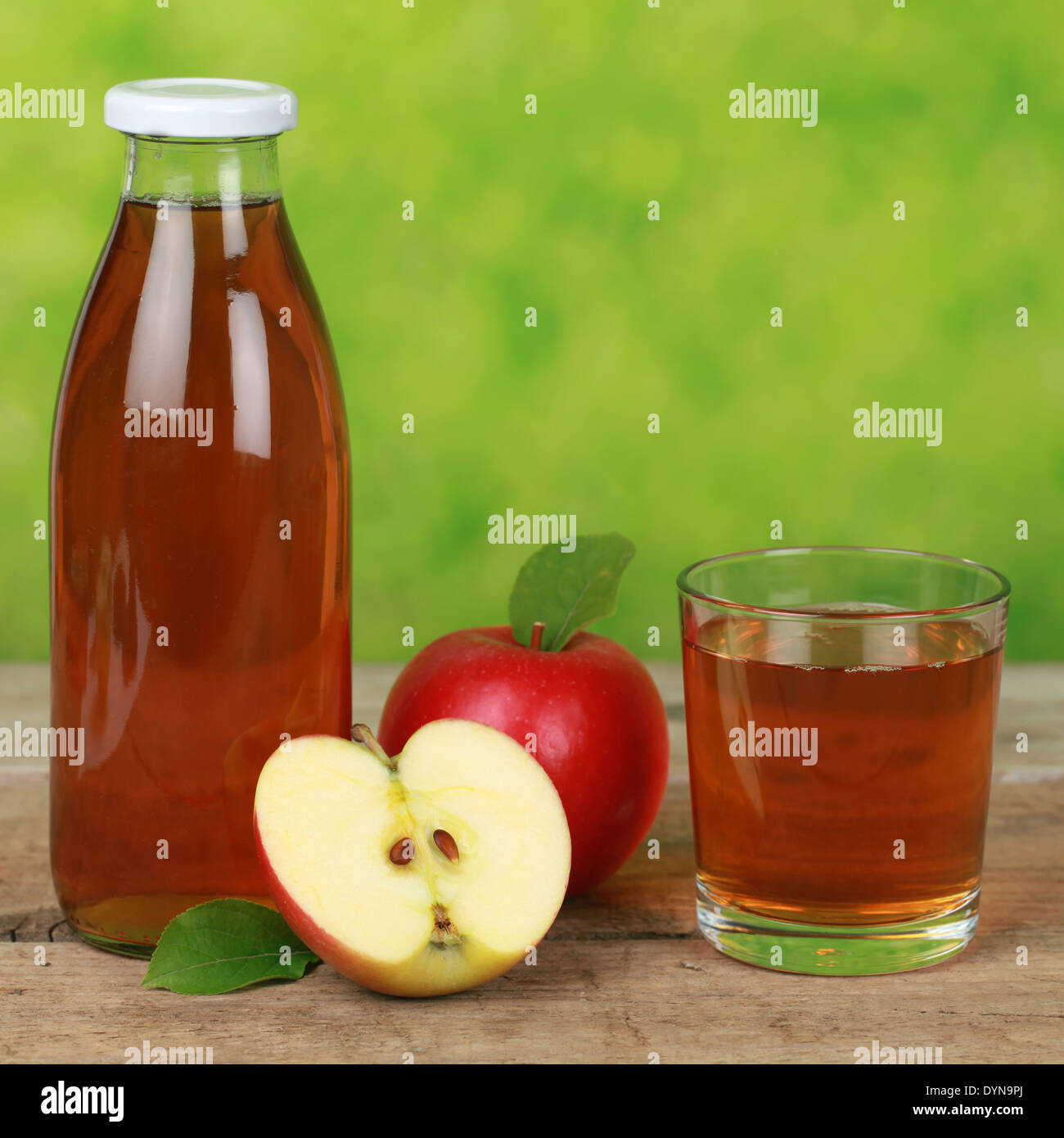 Fresh apple juice served in a bottle and in a glass Stock Photo