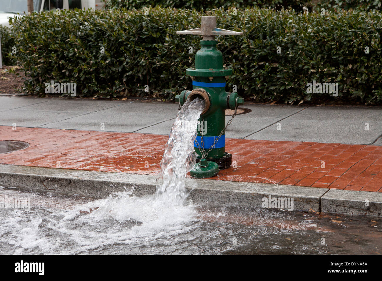 Open fire hydrant valve on city sidewalk USA Stock Photo Alamy
