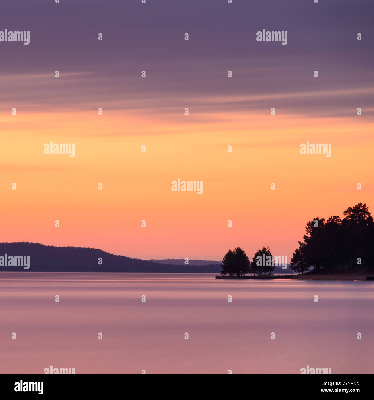 Dramatic sky over a calm lake Stock Photo