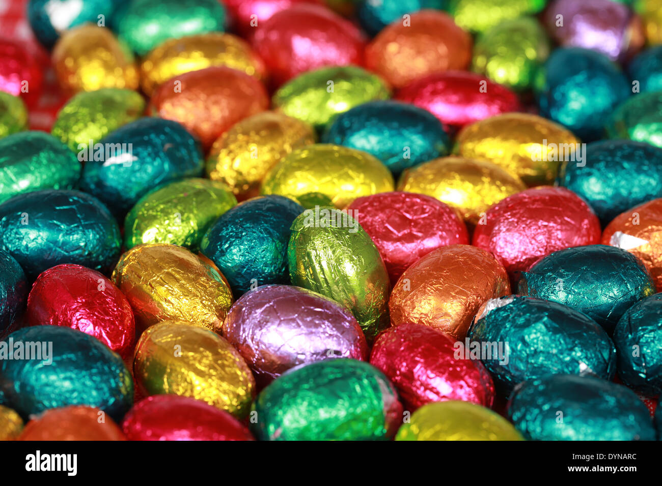 Colorful chocolate Easter eggs forming a background Stock Photo