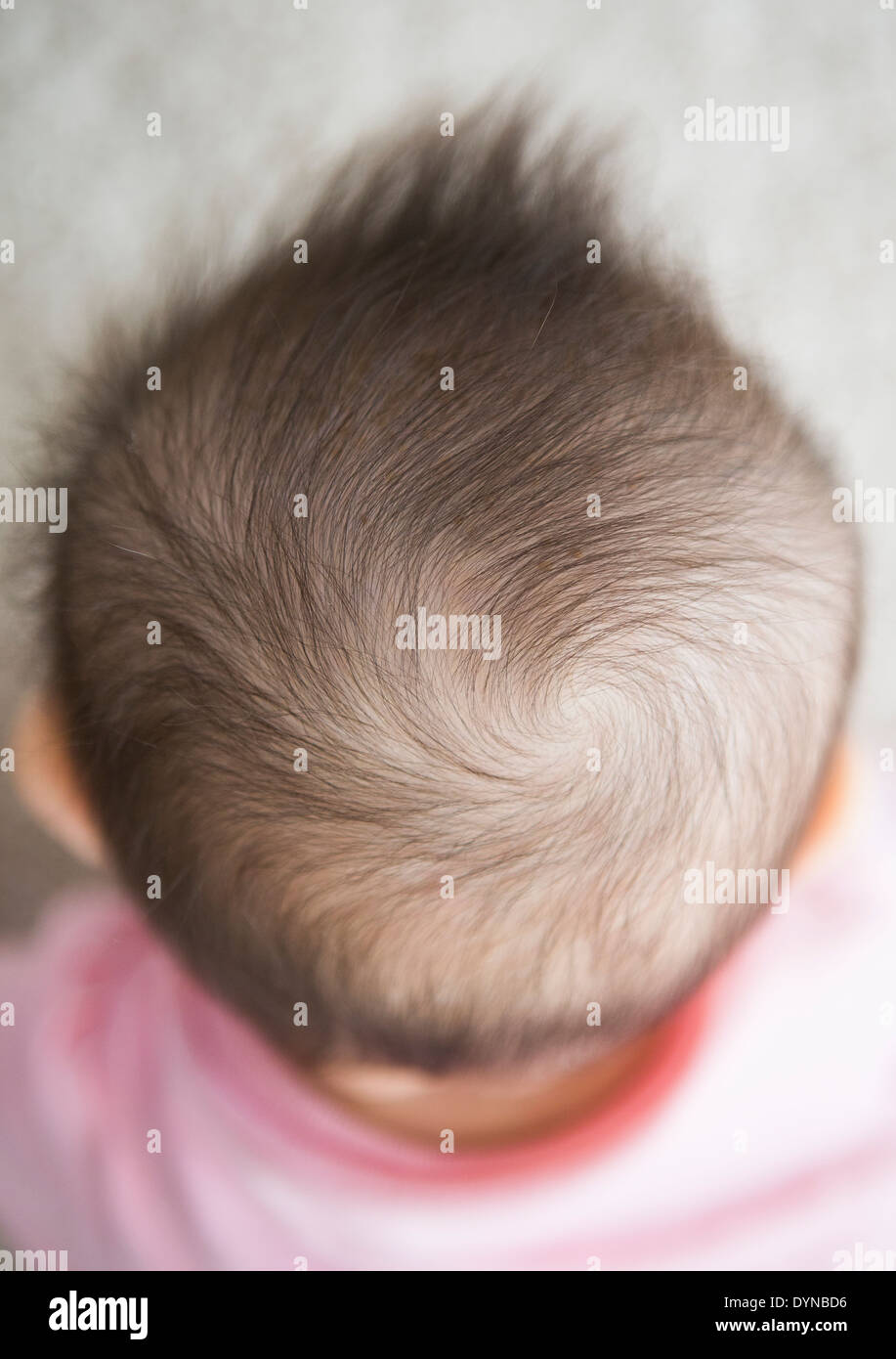 Close up of mixed race baby girl's hair Stock Photo