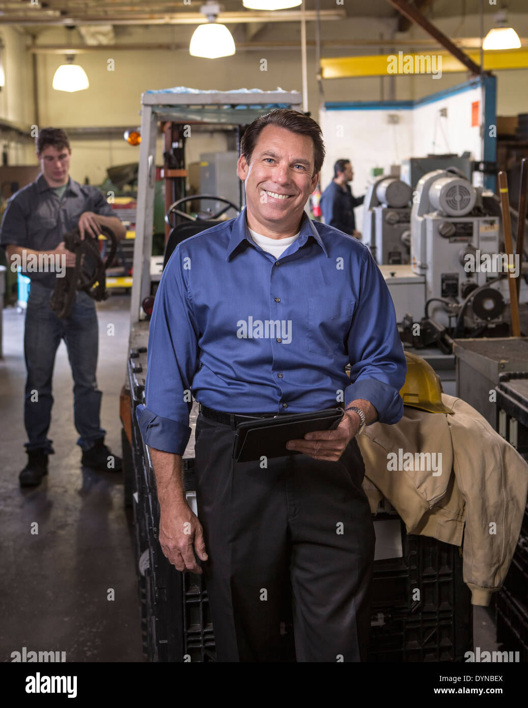 Manager using digital tablet in warehouse Stock Photo