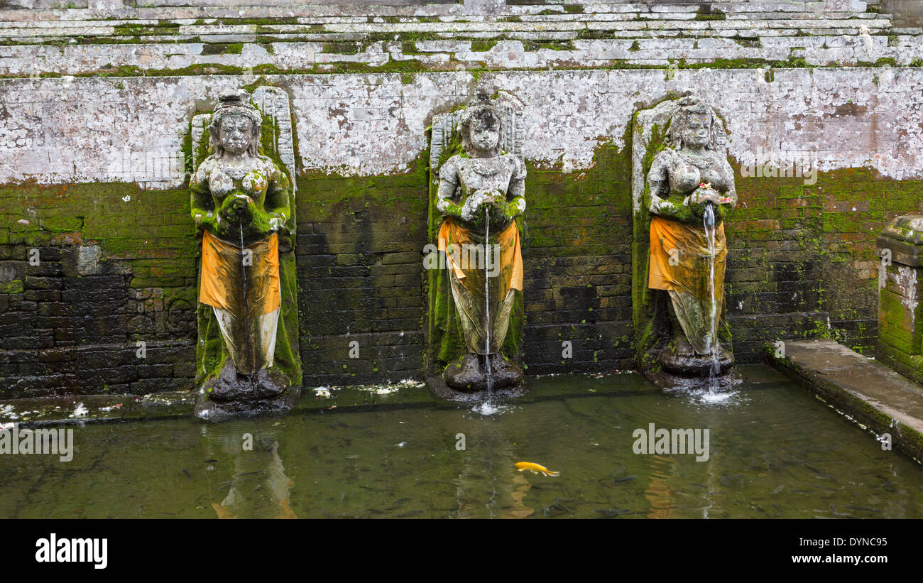 Moss growing over Hindu statues, Ubud, Bali, Indonesia Stock Photo