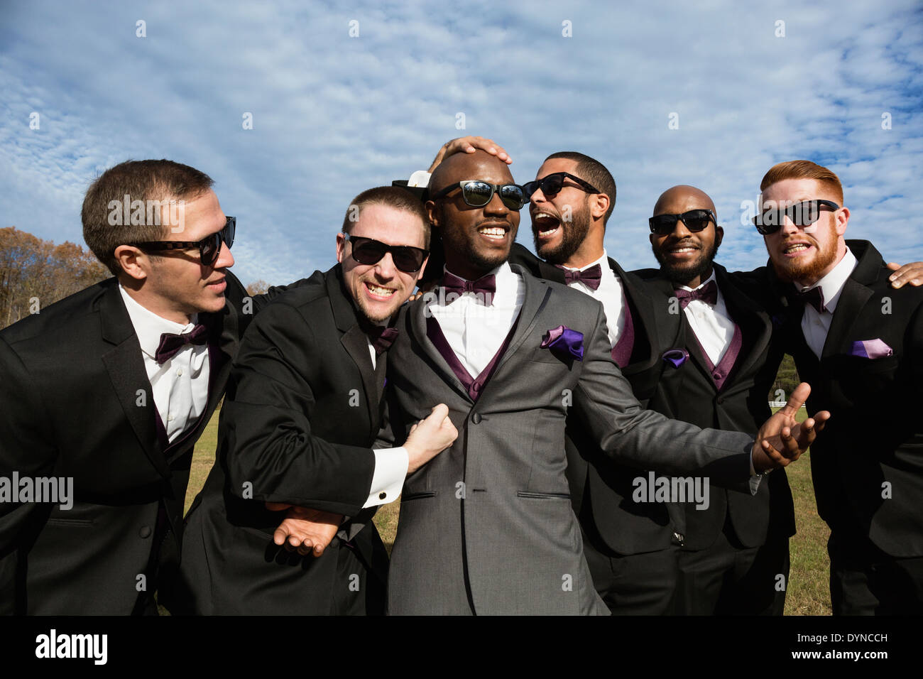 Groom and groomsmen posing for wedding pictures Stock Photo