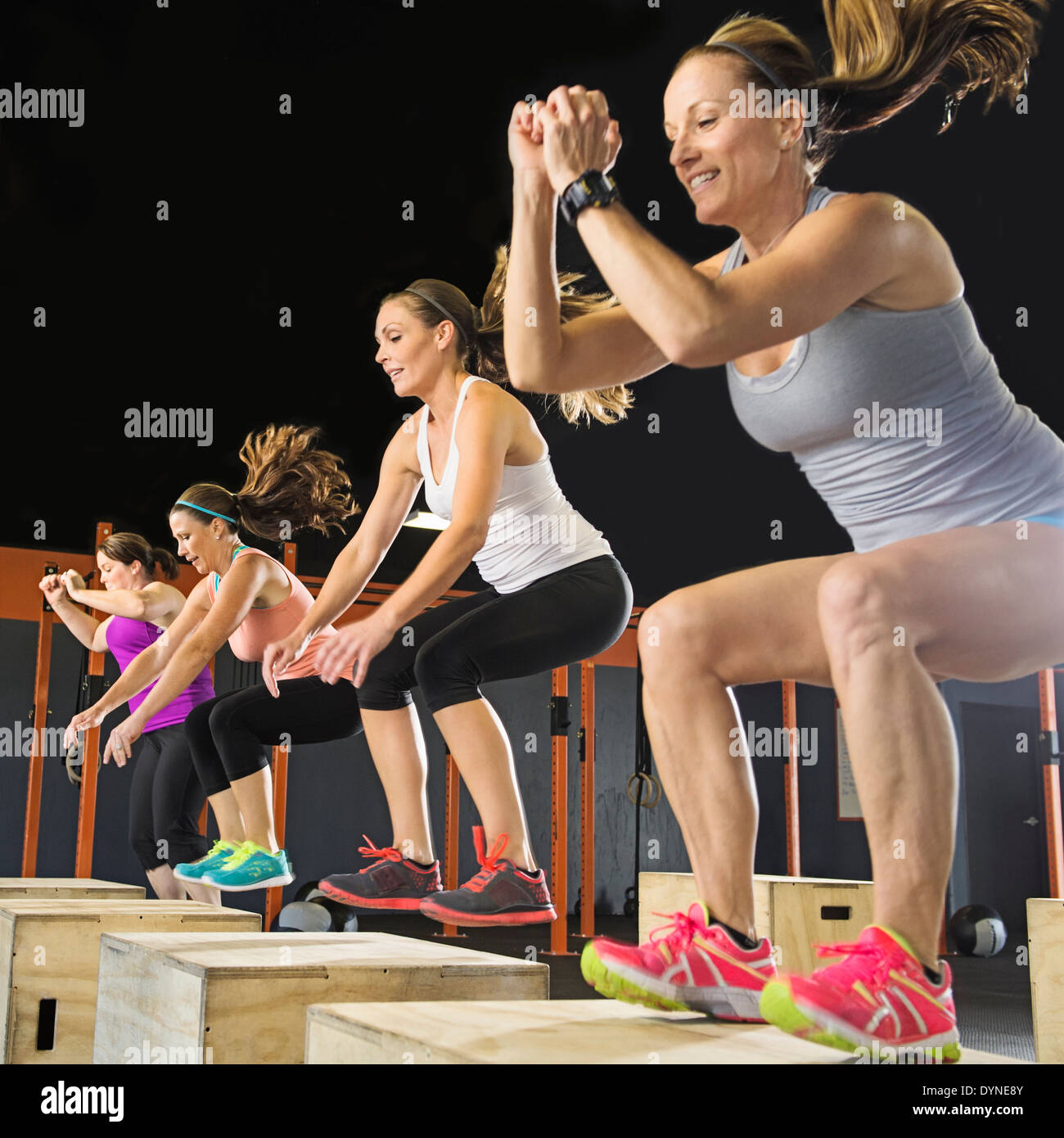 Women training together in gym Stock Photo