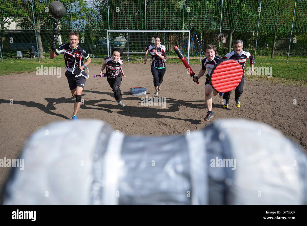ILLUSTRATION Shielded fighters with cushioned swords and chains fight