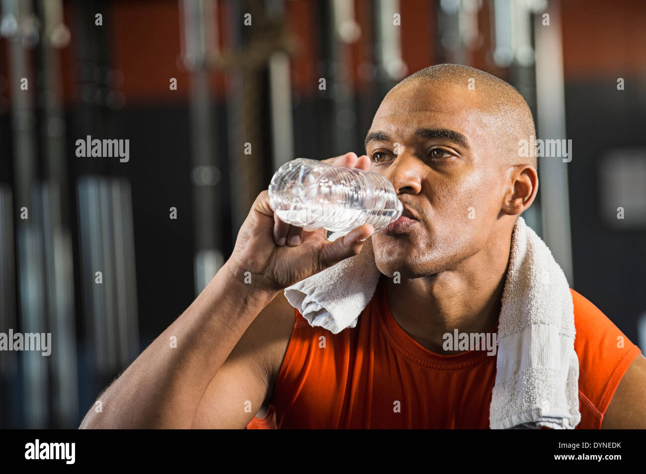https://c8.alamy.com/comp/DYNEDK/black-man-drinking-water-in-gym-DYNEDK.jpg