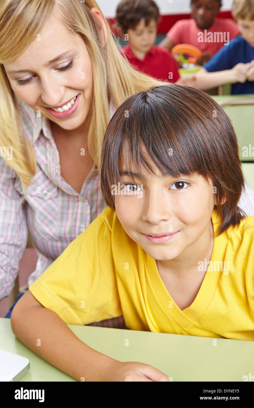 Japanese student and teacher together in elementary school class Stock Photo