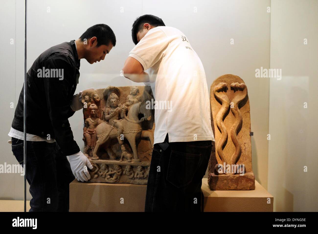 Taiyuan, China's Shanxi Province. 23rd Apr, 2014. Staff members fix the exhibit at Shanxi Provincial Museum in Taiyuan, capital of north China's Shanxi Province, April 23, 2014. 'India's Universe--the Exhibition of Masterworks of the Los Angeles County Museum of Art (LACMA)' is to be held in Shanxi Museum in Taiyuan on April 29. © Fan Minda/Xinhua/Alamy Live News Stock Photo