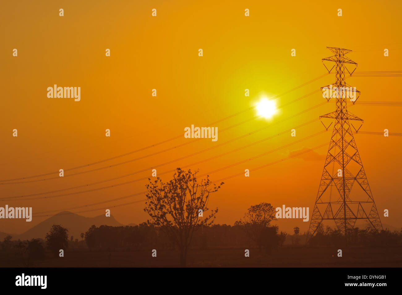 High voltage power pylons in sunset scene twilight Stock Photo - Alamy