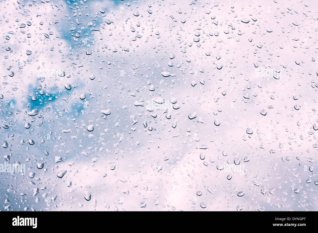 Water drops on window glass, blurred on the edges. Image processing with  color filter effects Stock Photo - Alamy