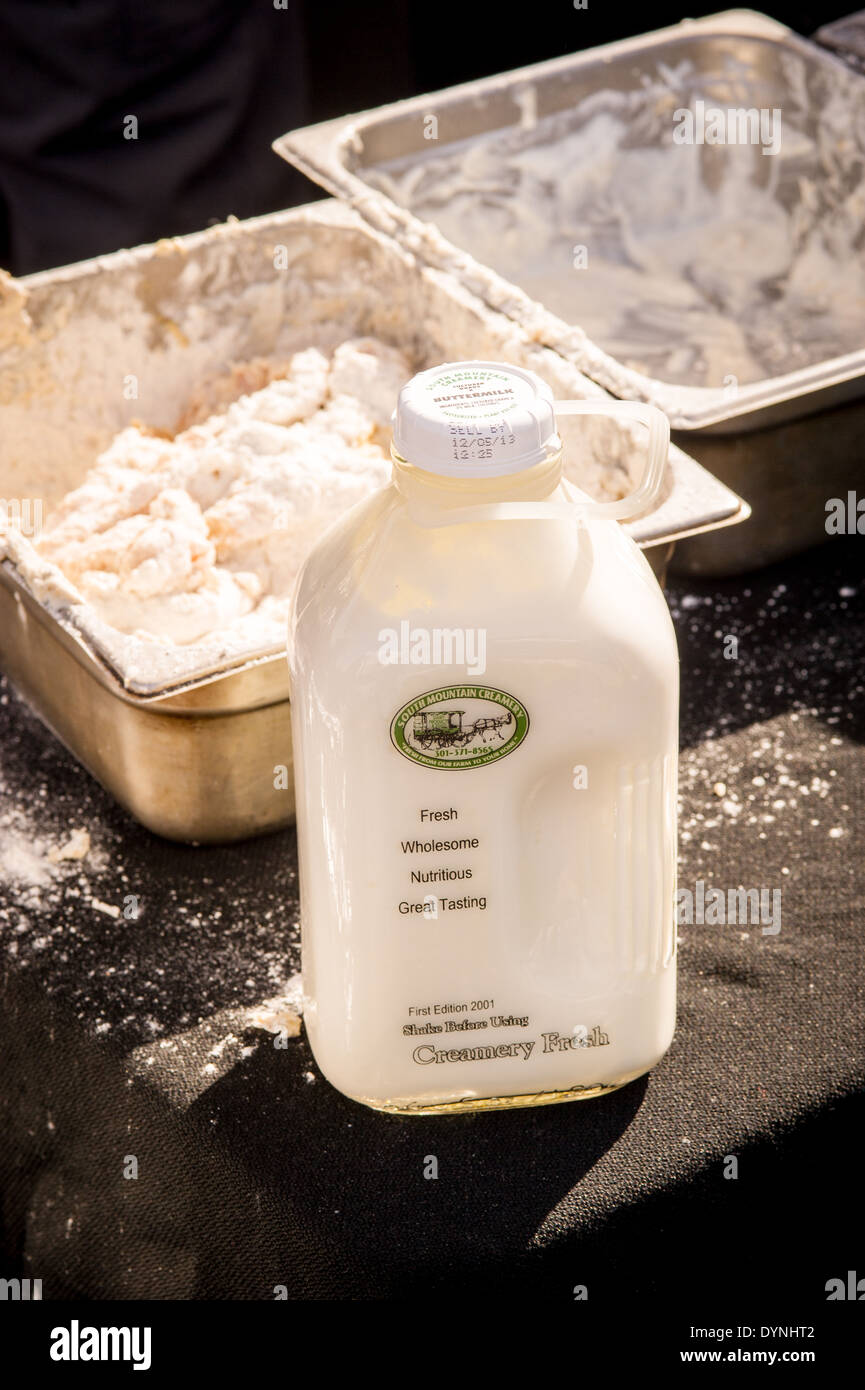 Glass bottle of milk in front of batter mixture at the Waverly Farmers Market in Baltimore, Maryland Stock Photo