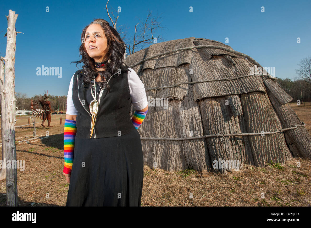 Piscataway Native American woman standing outside near wigwam at the Piscataway indian cultural center in Waldorf MD Stock Photo