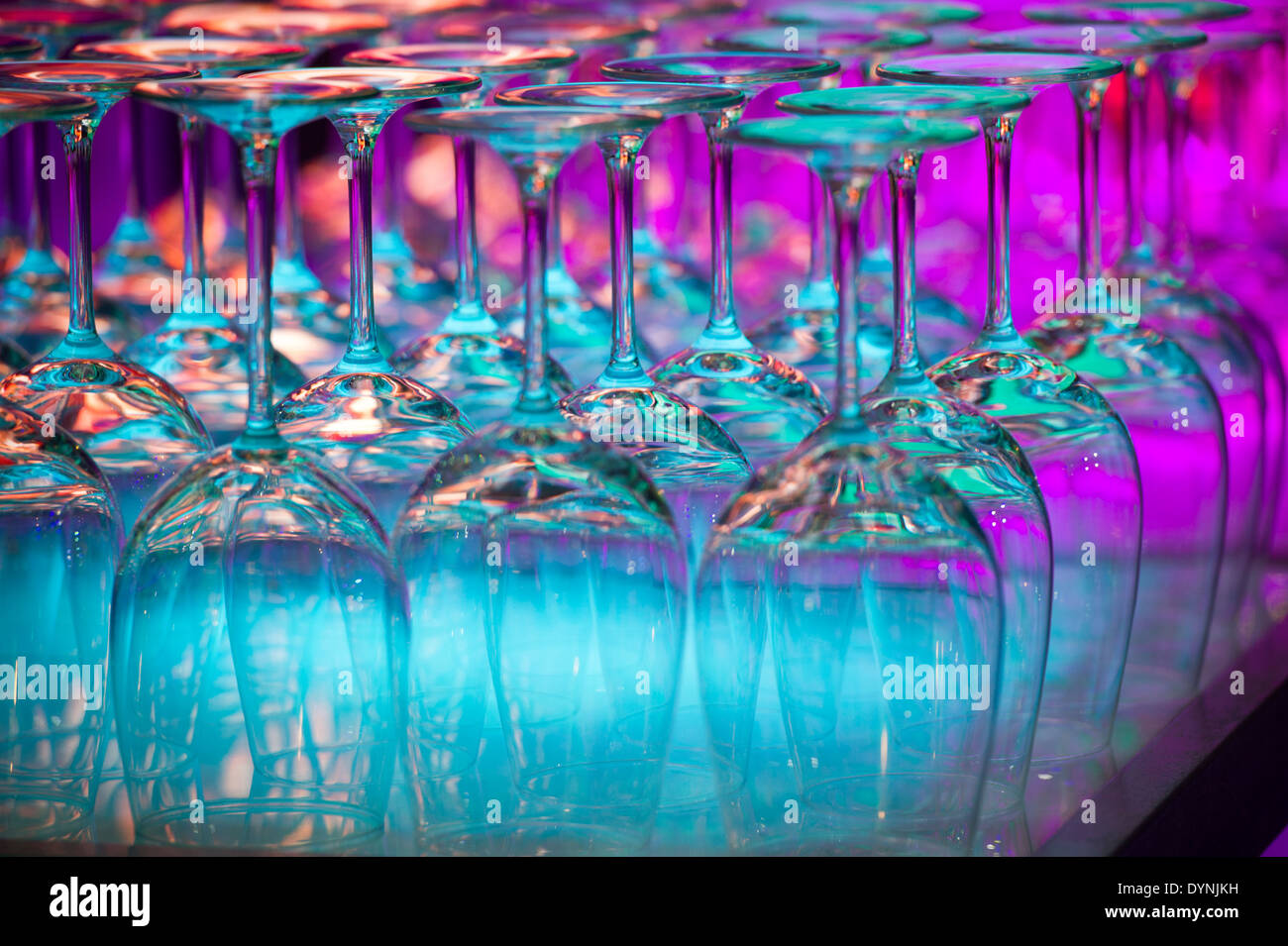 Wine glasses on a shelf with colored lights in Baltimore, Maryland Stock Photo