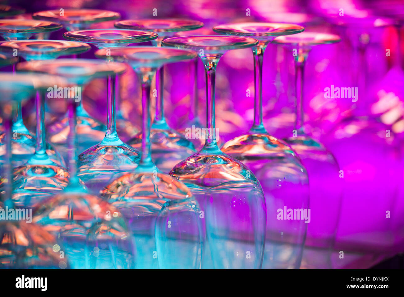 Wine glasses on a shelf with colored lights in Baltimore, Maryland Stock Photo
