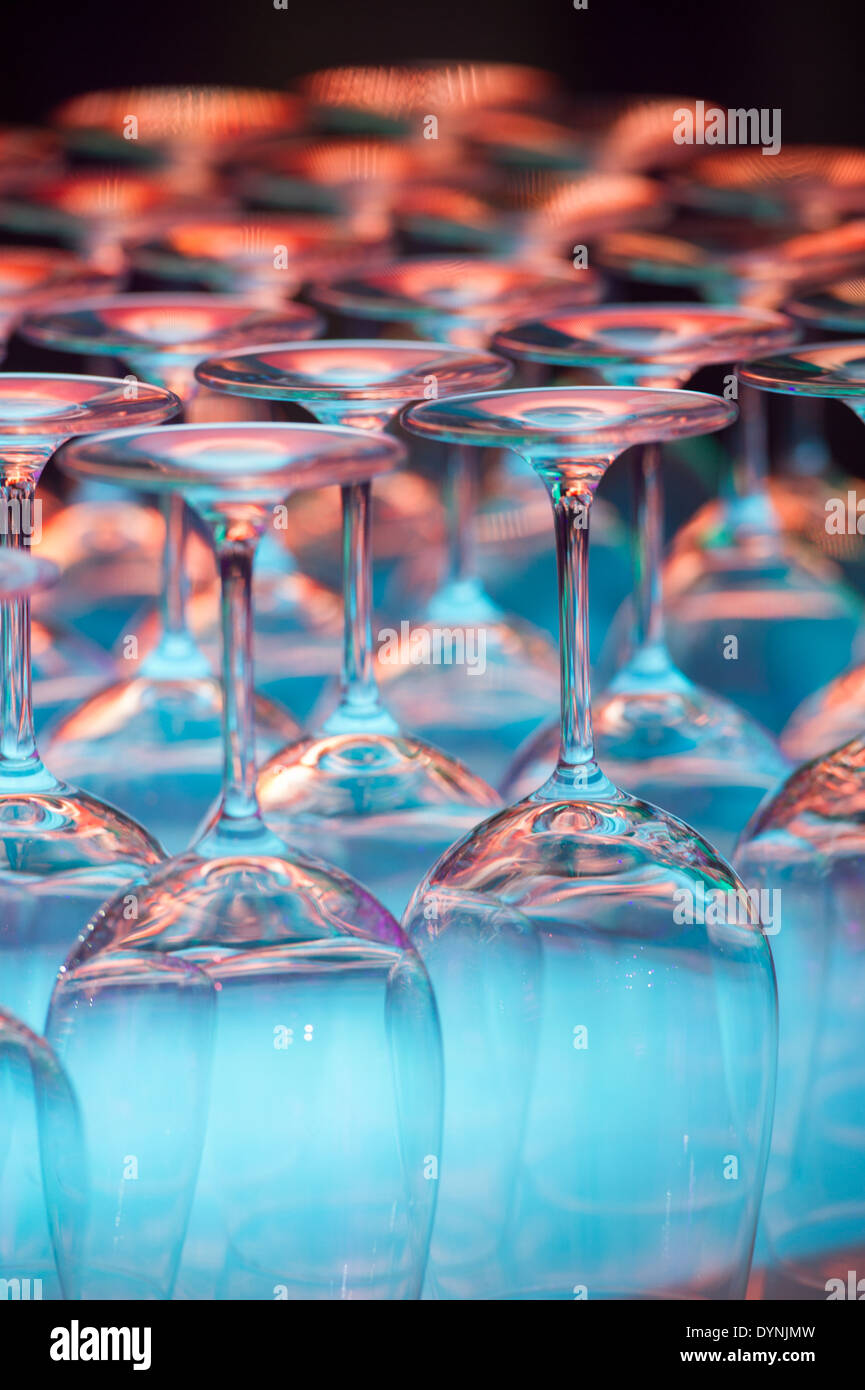 Wine glasses on a shelf with colored lights in Baltimore, Maryland