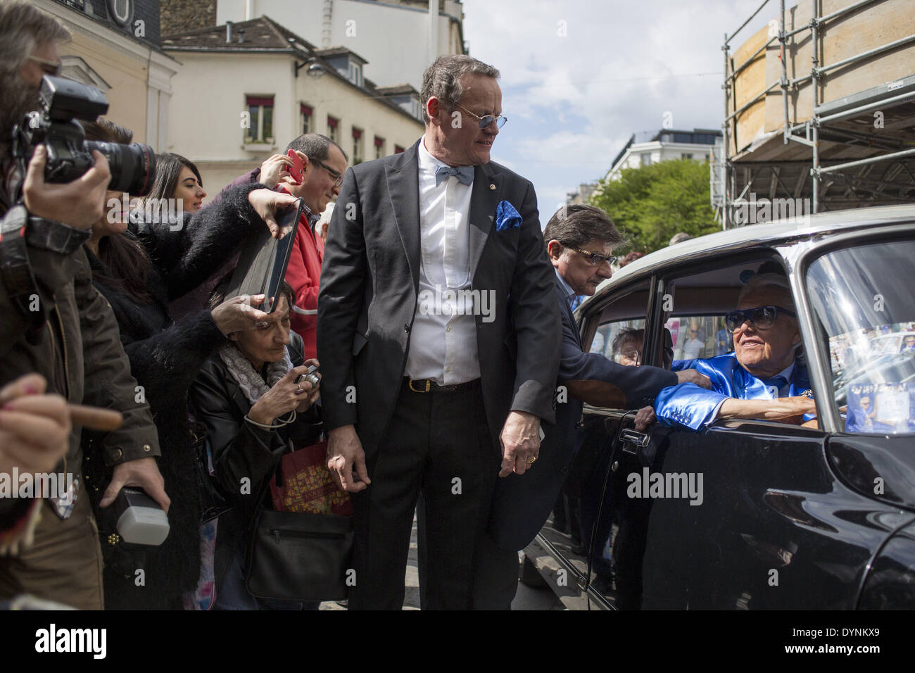 Paris, France. 19th Apr, 2014. French cabaret director, Michel Georges Alfred Catty a.k.a Michou arrival in the Michou Day flashMob in Paris, with a blue dresscode, on April 19, 2014. Around 200 people gathered, dressed in blue to throw up confetti, in Jehan Rictus Square in Montmartre, Paris. (Photo by Michael Bunel/NurPhoto) © Michael Bunel/NurPhoto/ZUMAPRESS.com/Alamy Live News Stock Photo