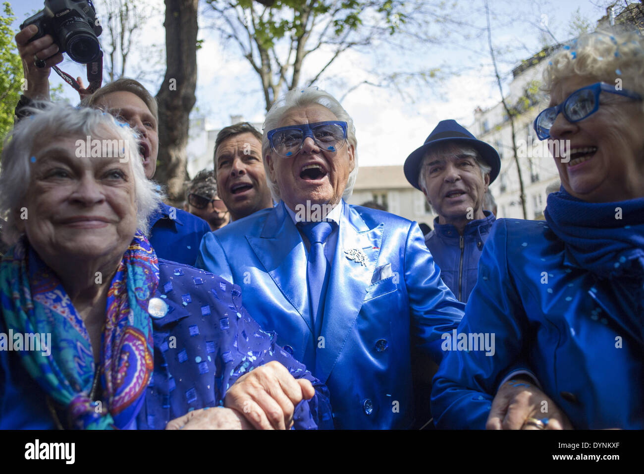 Paris, France. 19th Apr, 2014. French cabaret director, Michel Georges Alfred Catty a.k.a Michou arrival in the Michou Day flashMob in Paris, with a blue dresscode, on April 19, 2014. Around 200 people gathered, dressed in blue to throw up confetti, in Jehan Rictus Square in Montmartre, Paris. (Photo by Michael Bunel/NurPhoto) © Michael Bunel/NurPhoto/ZUMAPRESS.com/Alamy Live News Stock Photo