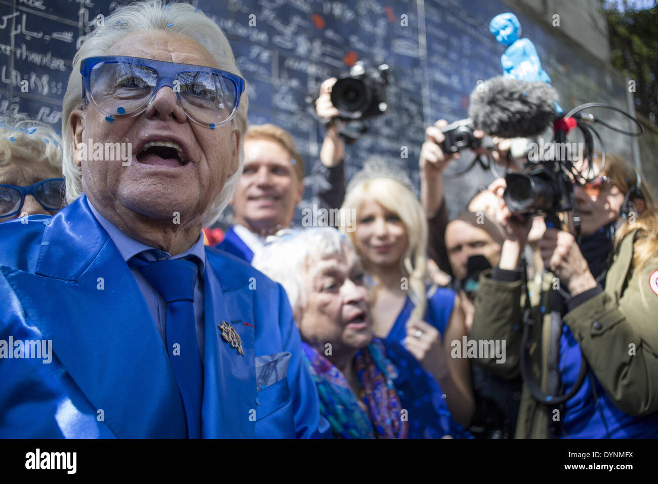 Paris, France. 19th Apr, 2014. French cabaret director, Michel Georges Alfred Catty a.k.a Michou arrival in the Michou Day flashMob in Paris, with a blue dresscode, on April 19, 2014. Around 200 people gathered, dressed in blue to throw up confetti, in Jehan Rictus Square in Montmartre, Paris. (Photo by Michael Bunel/NurPhoto) © Michael Bunel/NurPhoto/ZUMAPRESS.com/Alamy Live News Stock Photo