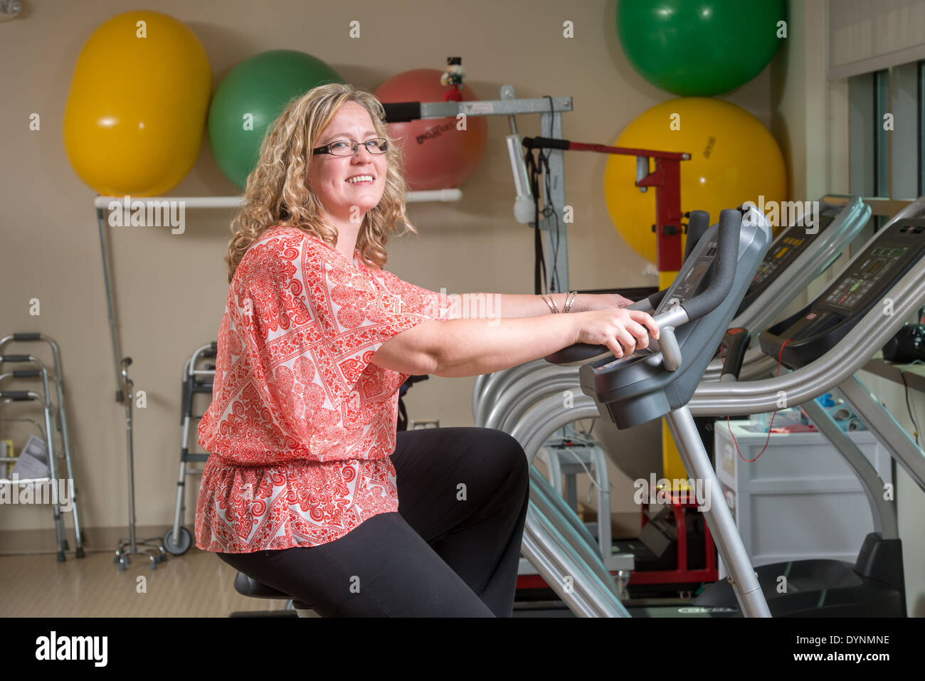 Grateful Patient at rehab, exercising on a stationary bike Bel Air, Maryland Stock Photo
