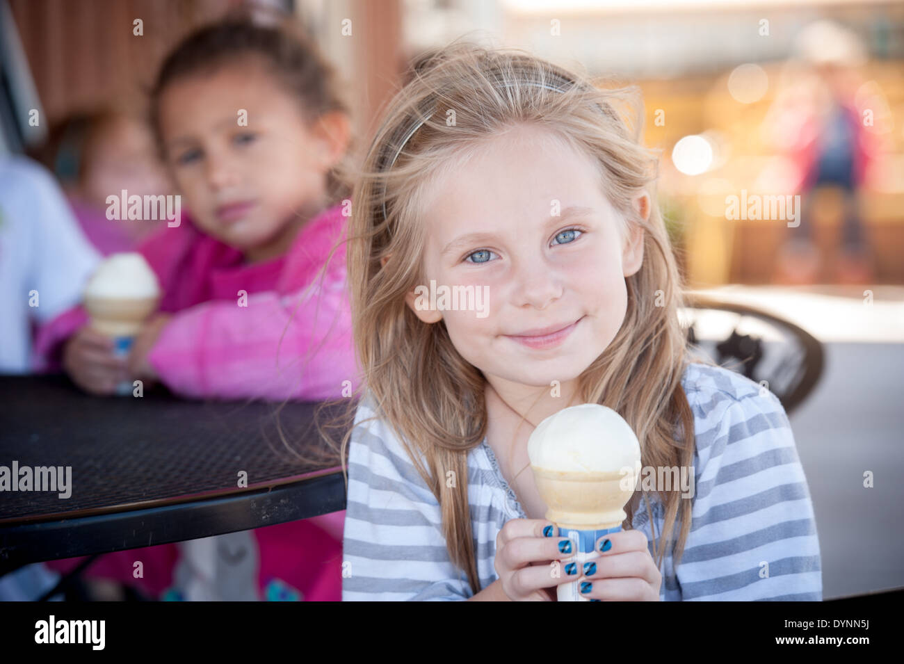 Girl holding ice cream cone with blue painted fingernails Hagerstown
